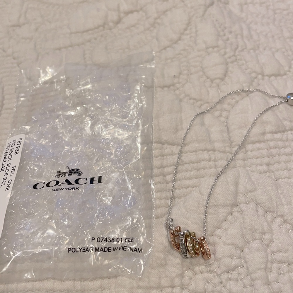 New! Coach slider bracelet. Multi color “C’s”